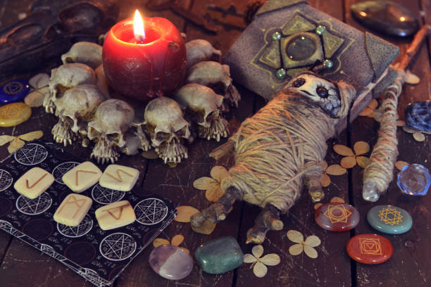 istock Wicca, esoteric and occult still life with vintage magic objects and voodoo doll on witch table altar for mystic rituals and fortune telling. Halloween and gothic concept 1398923486