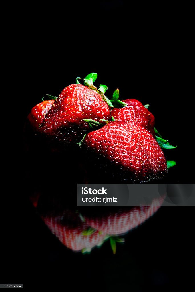 Strawberries Macro of strawberries Black Background Stock Photo