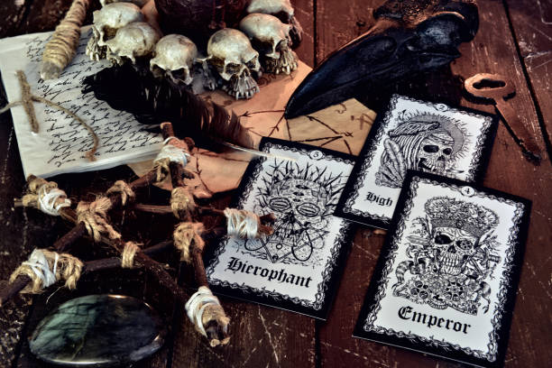 istock Wicca, esoteric and occult still life with vintage magic objects and tarot cards with skulls on witch table altar for mystic rituals and fortune telling. Halloween and gothic concept 1398924069