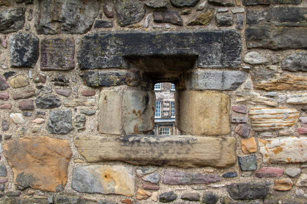Edinburgh, Scotland, United Kingdom - April 27, 2022: A view of a building in Edinburgh, Scotland, through a window in Edinburgh Castle.