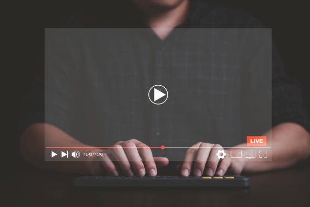 istock Man use laptop computer to watching and live streaming window for Video streaming on internet and multimedia technology concept. 1398926237