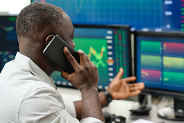 istock Young African American Broker At Work 1398927227