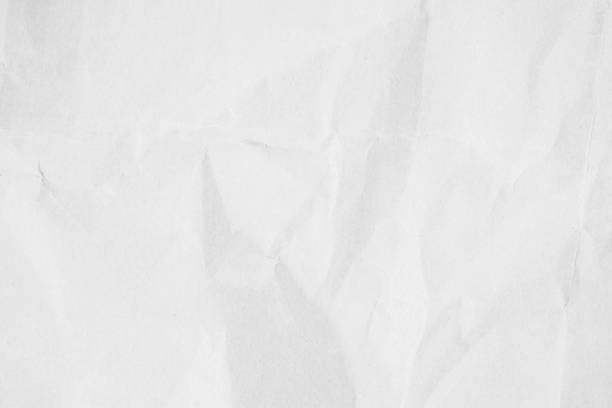 istock Crumpled white paper texture background for various purposes. 1398929420