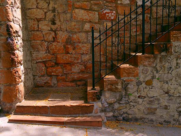 istock Stone stairway partially in strong sunlight 139893300