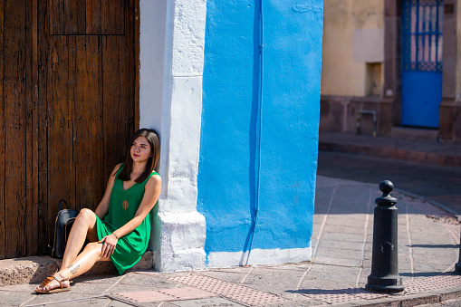 Woman enjoying the street of the city, with blue background.