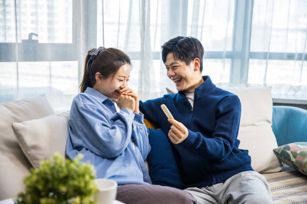 istock Young couple happy for positive pregnancy test 1398933097