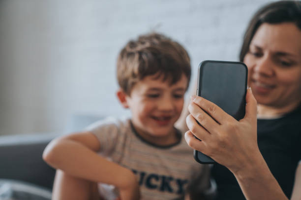 istock Mother and her son video chat 1398933107
