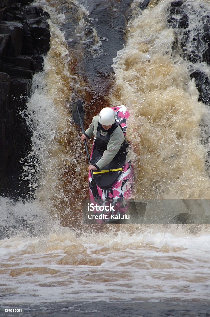 Canoeist A canoeist, shooting a raging waterfall, on the River Tees, UK. Canoe Stock Photo