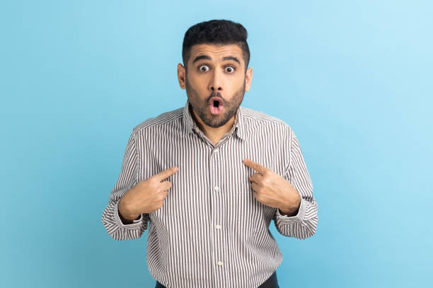 istock Businessman pointing finger on itself with surprised expression, wondered with sudden victory. 1398933917