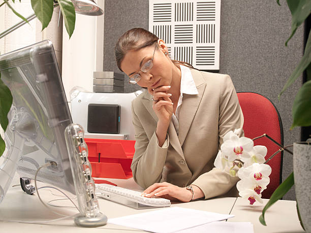 istock woman office worker, girl thinking on computer 139893594