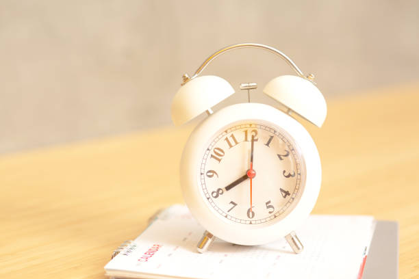 istock date and time on plywood background 1398938975