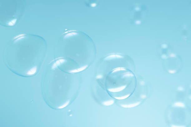 istock Beautiful Transparent Blue Soap Bubbles Floating in The Air. Soap Sud Bubbles Water 1398940124