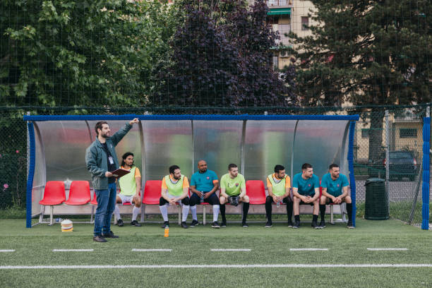 istock The coach and team players 1398942821