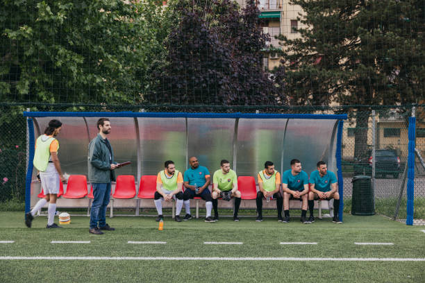 istock The coach and team players 1398943090