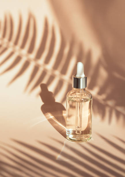 istock serum on beige background with natural shadow 1398943197