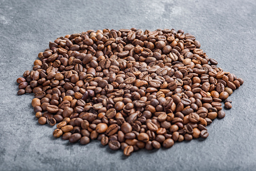 Coffee beans on textured background