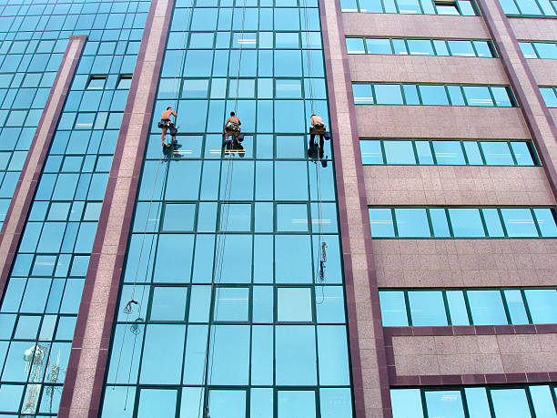 istock Workers  cleaning the windows of a corporate building. 139894399