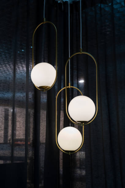 istock Lighting lamps hanging from the ceiling decorative in home interior 1398945300