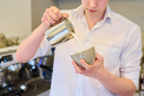 istock Barista making coffee in cafe 1398945479