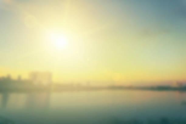 istock Relaxing outdoors vacation landscape concept: Abstract blurred sunlight beach colorful blurred bokeh background with retro effect autumn sunset sky have blue bright, white, and color orange calm. 1398946105