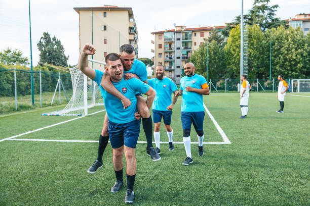 istock Soccer team celebrates a goal 1398947455