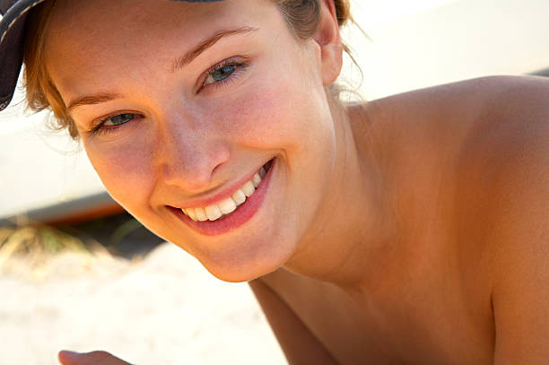 istock Happy young woman relaxing at the beach. 139894749