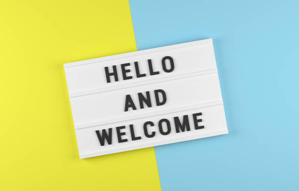 istock Hello and Wellcome written Lightbox on yellow and blue 1398949111