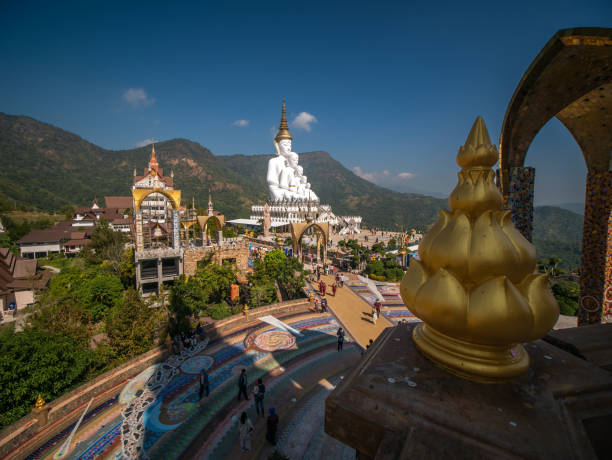 istock 5 White Buddha Statues Sitting on The Hill 1398949871