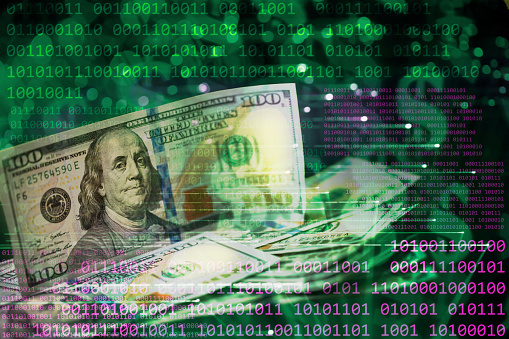 Binary code abstract background with US $100 dollar banknotes.