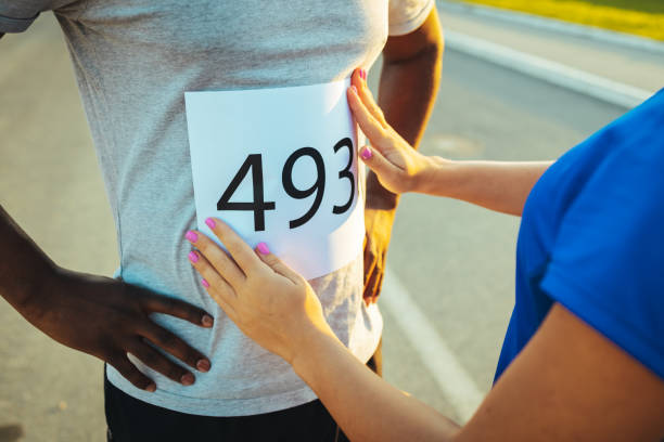 Friends preparing for running outdoors in the park. They are focused and determined.