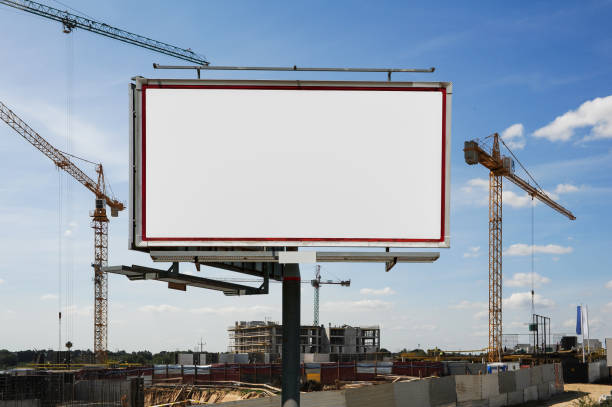 istock Blank white advertising billboard on the construction site 1398953789