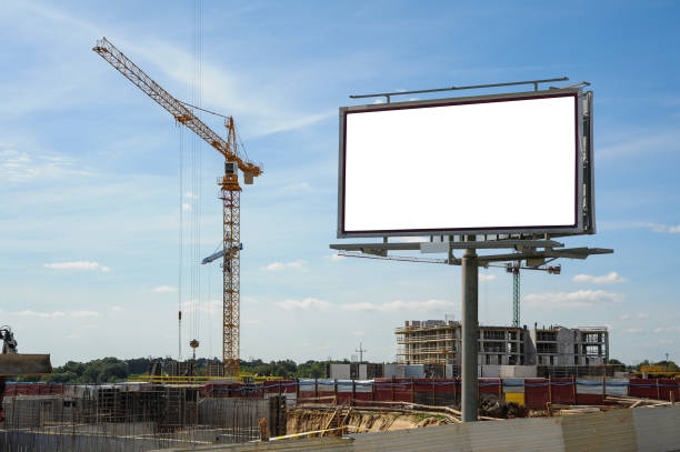 istock Blank white advertising billboard on the construction site 1398953801