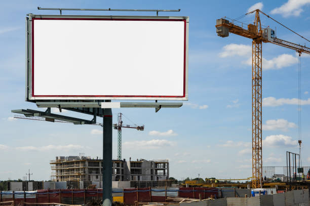 istock Blank white advertising billboard on the construction site 1398953841