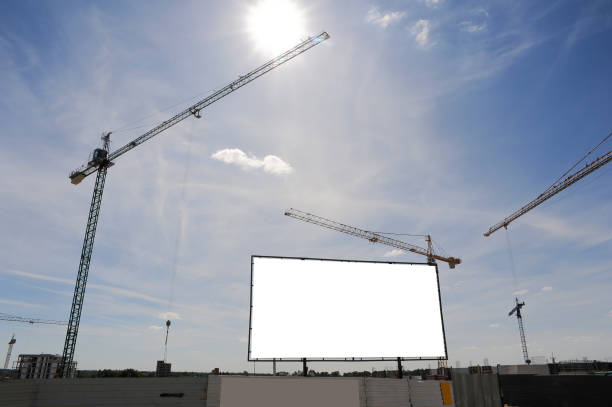 istock Blank white advertising billboard on the construction site 1398953930