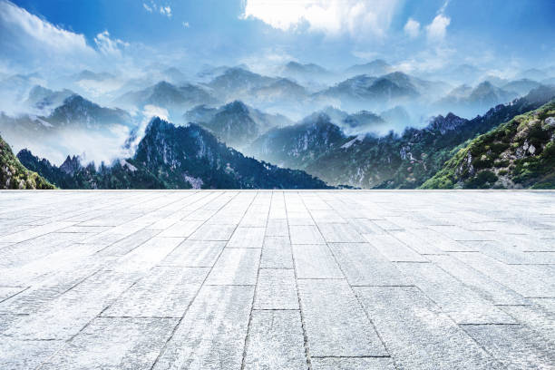 istock Skyline view of unmanned brick square and mountains under blue sky during daytime 1398954087