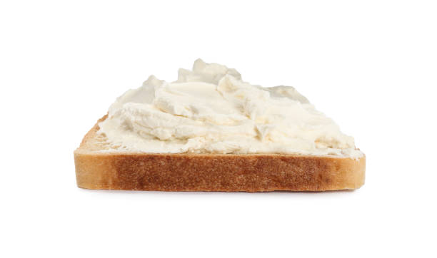 istock Toasted bread with cream cheese isolated on white 1398954277