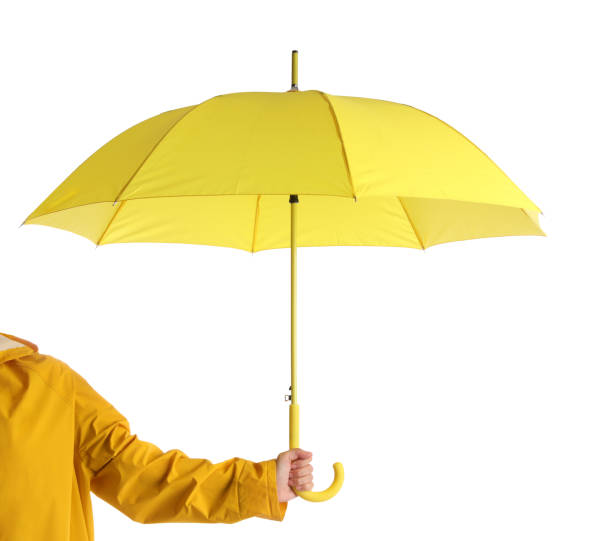 istock Woman with open yellow umbrella on white background, closeup 1398954292