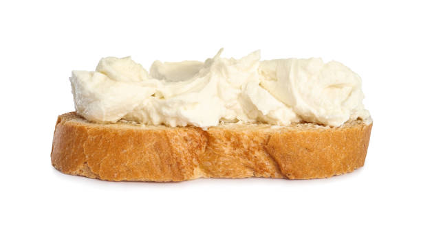 istock Toasted bread with cream cheese isolated on white 1398954300