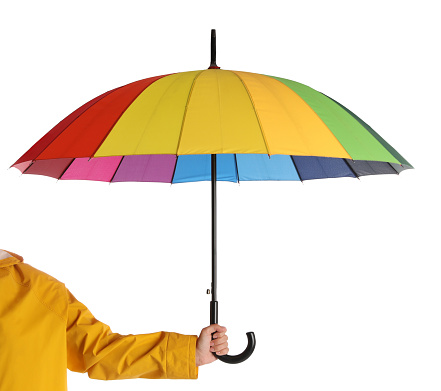 Woman with open bright umbrella on white background, closeup