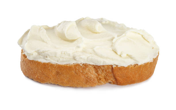 istock Toasted bread with cream cheese isolated on white 1398954470