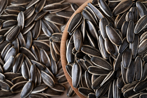 Black sunflower seeds in a bowl