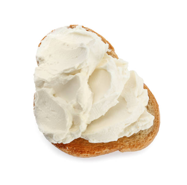 istock Toasted bread with cream cheese isolated on white, top view 1398955614