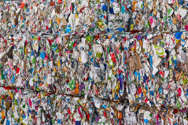 istock Recycled and packaged waste. Sustainable industry. Reusable material 1398957772