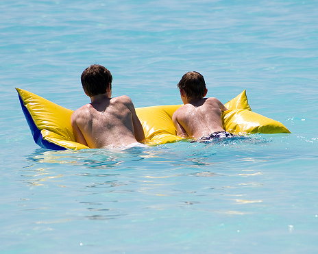 Brothers on a raft in the Carribbean