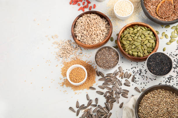 istock Variety of edible seeds on light background. 1398957854