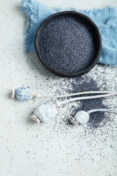 istock Composition with poppy seeds on gray background. 1398958070