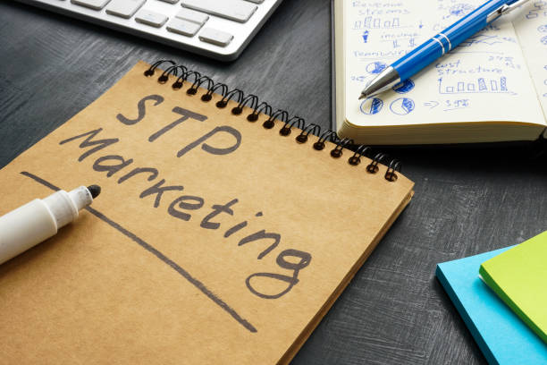 istock STP marketing written on the page. Segmentation targeting and positioning. 1398958143