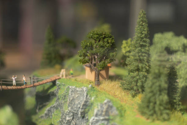 Model of mountainous area. Toy bridge in miniature. Tild shift shooting. Toy world.