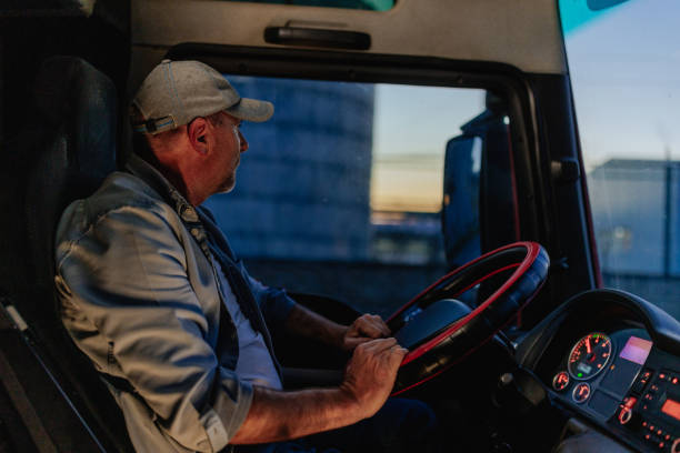 istock Middle-aged man driving a truck 1398960517