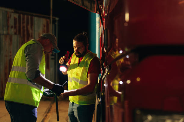 istock Truck diver inspecting safety daily check 1398961089